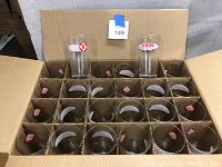 Open box showing 24 separated pint glasses with Harpoon logos, arranged in 4x6 grid in cardboard packing.