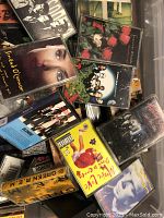 Close-up view of assorted tape cases and J-card artwork