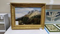 Frontal view of framed landscape painting showing overall composition