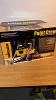 Box packaging of Wagner Paint Crew 770 airless paint sprayer showing branding and model info.