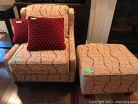 Chair with cushions and ottoman showing overall lot contents.