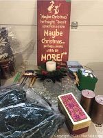 Wide view of all lot items including Dr. Seuss wood wall art, wreath, candles, gift boxes, and mini lights.