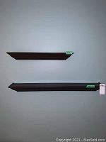 Photo showing two mounted brown wood wall shelves of different lengths and same depth against a grey wall.