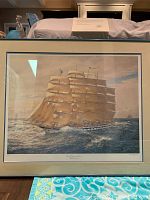 Photo of the framed Royal Clipper ship print by Geoff Hunt, showing the full piece including the frame and the authenticity certificate on top.