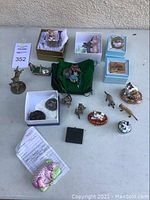 All trinket boxes and sculptures arranged on table