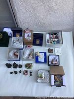 Overview of all items on table in original boxes and bubble wrap