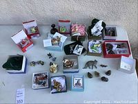 Overall view of all boxes and figurines arranged on table