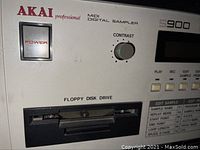 Front left view showing power switch, contrast knob, floppy disk drive and partial control panel