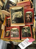 First image shows various boxed Hallmark Keepsake ornaments including Star Trek ships and Star Wars characters such as Luke Skywalker and Han Solo.