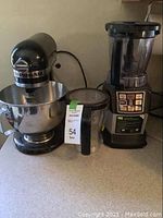 Side view showing KitchenAid mixer, Ninja blender base with pitcher and additional pitcher