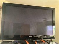 Front view of Panasonic 58" TV on stand