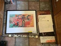 Framed art print 'Boy and Dog in a Johnnypump, 1982' attributed to Basquiat with other prints around it.