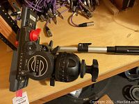 Overview of Sachtler Video 18 II fluid head mounted on workbench