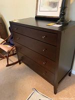 Front view of Baronet 4-drawer chest of drawers with metal knobs