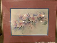 Front view of the framed floral artwork showing the entire piece, frame, and matting.