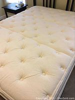 Close-up of tufted pillow top surface with button tufts