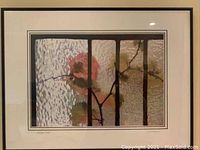 Full view of the framed, matted, signed artwork showing the floral branch behind textured glass with vertical black bars.