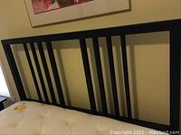 Headboard detail from the side showing the vertical bar design and frame proportions.