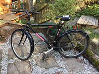 Full side view of the black Bridgestone MB-6 bicycle showing the 21-speed gears, frame size, and overall condition.