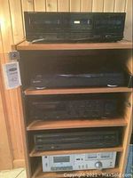 All components stacked on wood shelf: Pioneer deck (top), Sony turntable, Denon receiver, Denon CD player, Technics cassette deck (bottom)
