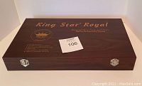 Closed wooden box case with King Star Royal branding and product details