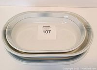 Three nested Arzberg oval serving dishes showing size variations and design