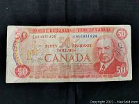 Full front view of the $50 note on black background