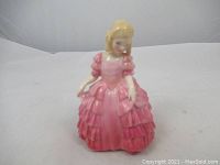 Front view of Royal Doulton Rose figurine showing detailed pink dress and figure posture.