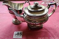 Teapot and creamer together on display