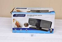Boxed Garrison two-zone ceramic heater showing product image, features, and branding.