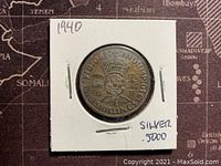 Reverse side showing denomination 2 Shillings, crown and lion design, silver marking .5000 and 1940 date.