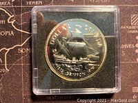 Reverse side showing sailing ship with year 1979 and inscriptions indicating 'DOLLAR CANADA'