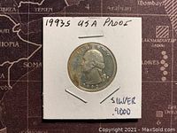 Obverse side of the 1993-S Silver Proof Washington Quarter showing the detailed profile of George Washington with the date 1993 and the text 'LIBERTY'. The coin is in a white cardboard holder.