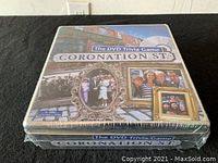 Photo of the Coronation Street DVD Trivia Game box showing various images from the show and the game title