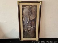 Full view of framed picture showing entire artwork of two elephants.