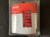 Photo of sealed Ztech branded zipper iron covers package in red and black colors.