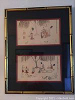 Full view of both framed art prints showing bamboo style frames and matting.