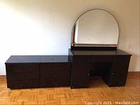 Front view of the mirrored dresser showing arch mirror and drawer fronts