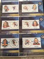 Six Canada hockey player commemorative stamps displayed on album page with player portraits