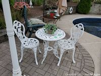 Full view of table and chairs on patio showing set arrangement