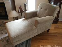 Front and side view of cream chaise lounge showing full length and armrest
