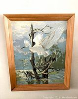 Full view of vintage paint by number white heron painting in wooden frame
