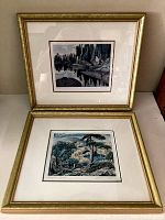 Two framed prints displayed, showing overall condition and style of both artworks