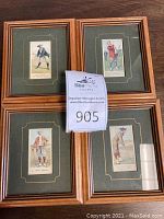 Set of four framed tobacco cards with green matting and gold trim, each 5 x 6 inches.