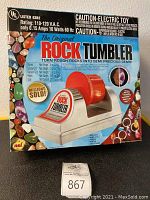 Photo of the original box showing brand, model and image of the rock tumbler machine.