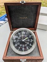 Tamaya MQ-2 Marine Quartz Chronometer clock in its original mahogany box with visible luminous hands and clear clock face.