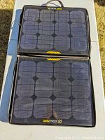 Two Goal Zero 30 W foldable panels laid flat side by side