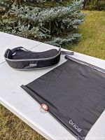 Kids car lap tray and Brica car window shade on table outdoors