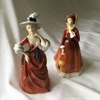 Both Royal Doulton and Francesca Art China porcelain figurines pictured together showing overall condition and scale.