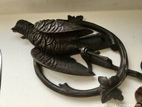 Close-up of large bird carving highlighting detailed feathers and minor beak damage
